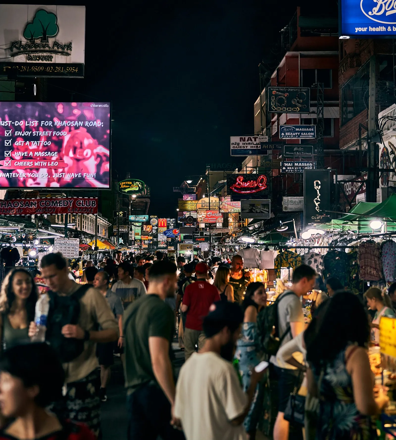 Khaosan Road Bangkok at night with crowds and neon signs - Where to Smoke Weed in Bangkok
