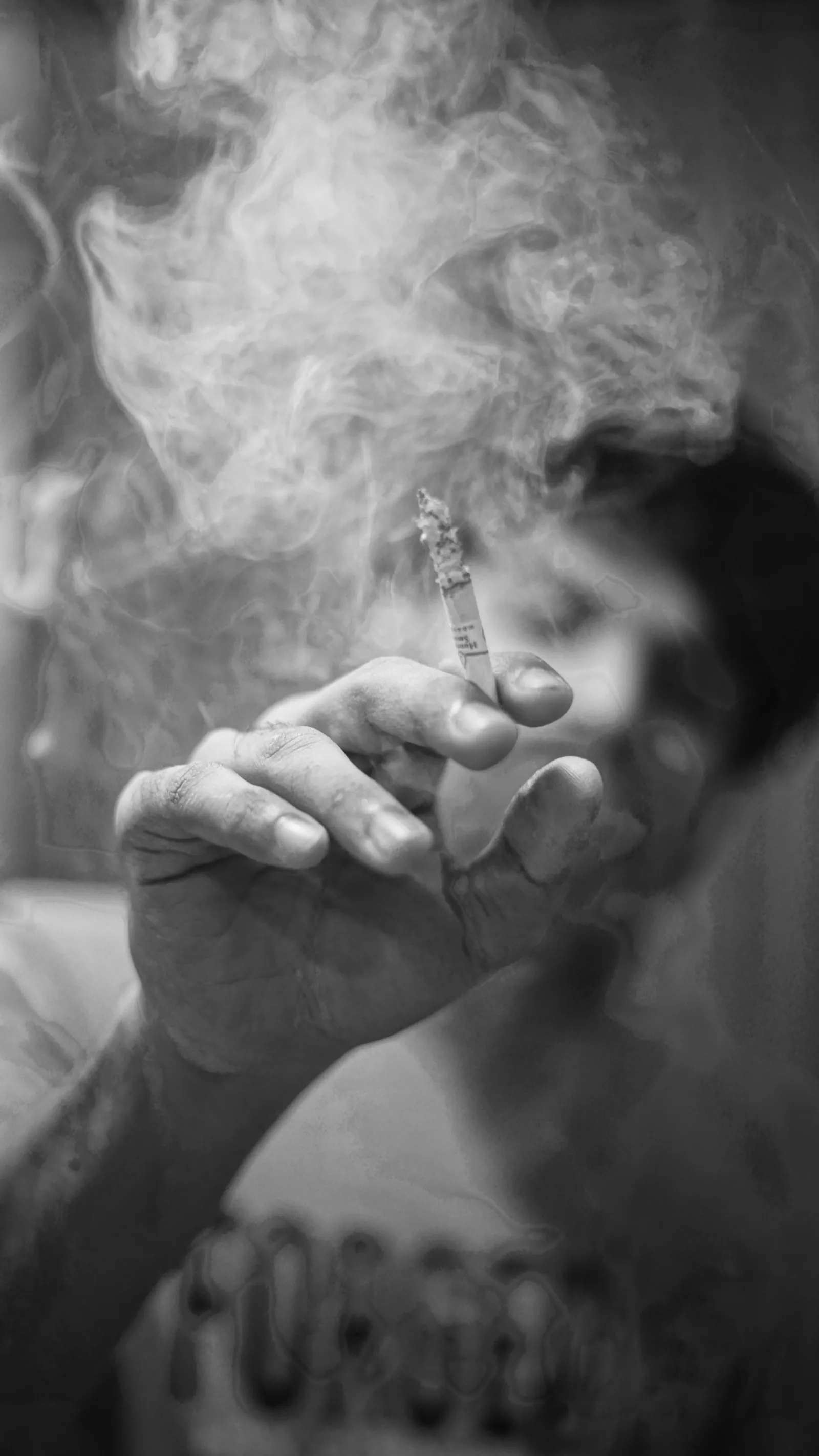 Editorial black and white portrait with smoke cloud, moody and high-contrast